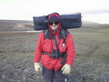 Bo Landin carrying the tri pod and camera equipment on Tundra Expedition -99 (Canadian Nunavut)